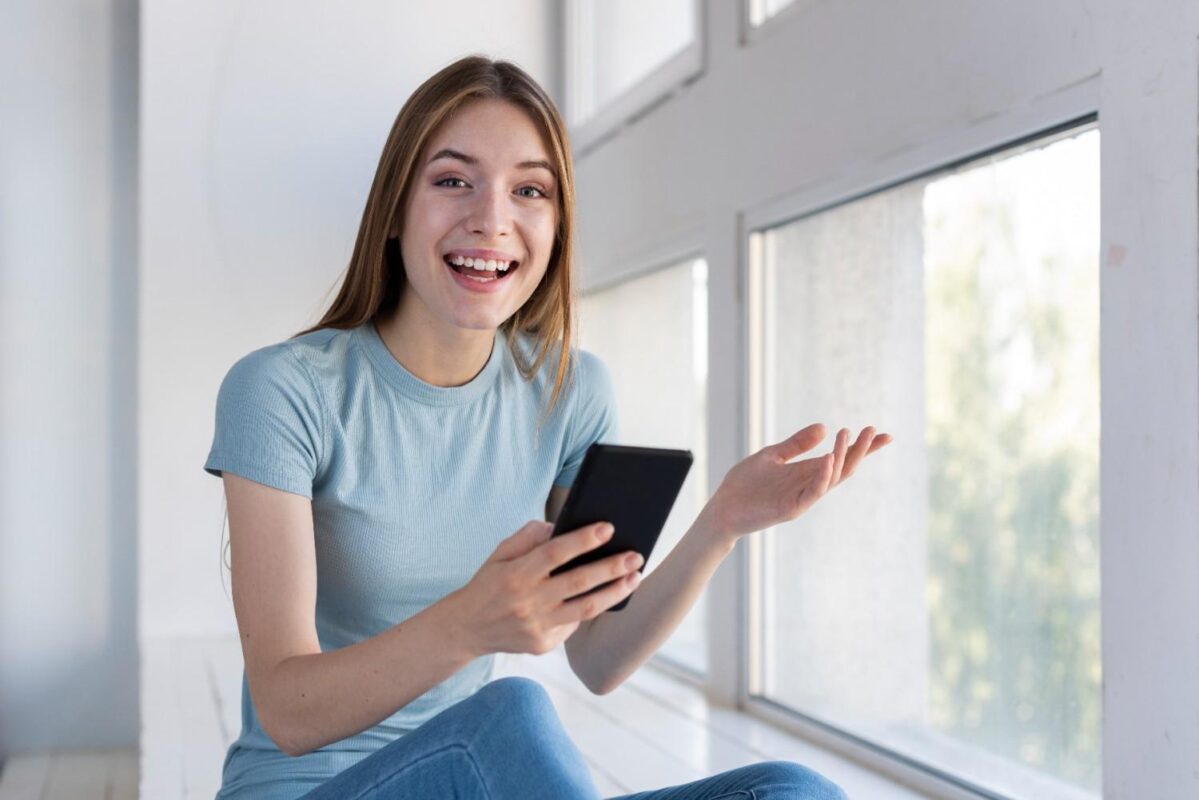 surprised women holding her phone