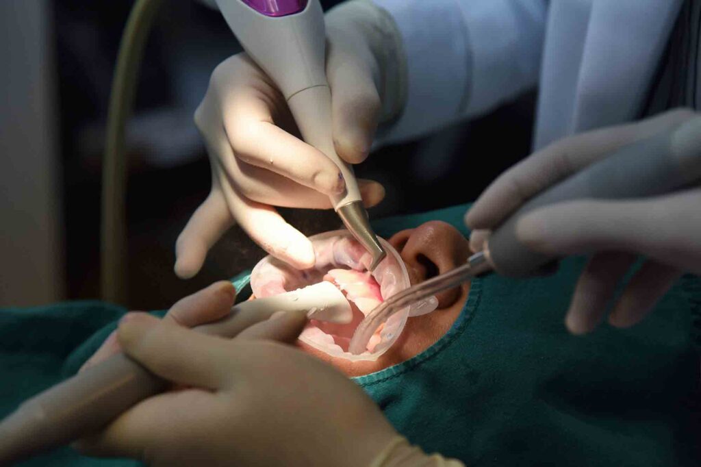 Dental care check up, Dentist examining and doing teeth treatment in dental clinic, Yearly visit for teeth cleaning and scaling to prevent gum disease problems, Healthy oral hygienic.